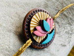 The Rising Lotus - QQ Signature Rakhis