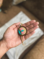 The Rising Lotus - QQ Signature Rakhis